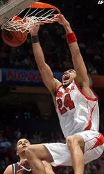 Luke Whitehead (24) dunks against Butler in the first half.