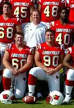 Head Coach Bobby Petrino is flanked by Dan Koons (68), Rod Day (40), Scott Lopez (90) and Chad Pinkston (60).