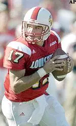 Stefan Lefors looks for a receiver as he rolls out during the first half.