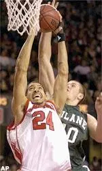 Luke Whitehead takes the ball to the hoop but is fouled by Tulane's Vytas Tatarunas.