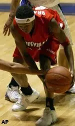 Angel Bradley guards the ball against TCU defenders.