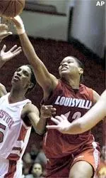 Jazz Covington grabs a rebound away from Houston's Kiemona Harris during overtime.