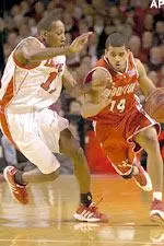 Brandon Jenkins plays tough defense against Houston's Kevin Barber during the first half.