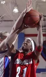 Angel Bradley attacks the basket against the Lady Blue Demons.