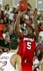 Louisville's Taquan Dean, right, shots over Stanford's Matt Haryasz in the second half.