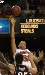 Francisco Garcia gets a shot off over the defense of Eastern Kentucky's Michael Haney.