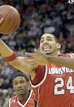 Luke Whitehead pulls a rebound away from a Cincinnati defender in the first half.