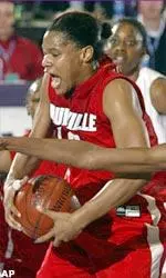 Jazz Covington is fouled as she protects the ball from a TCU defender.