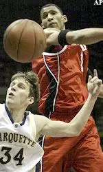 Kendall Dartez deflects the ball from Marquette's Travis Diener.
