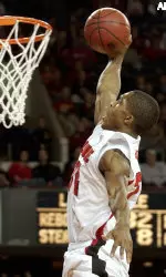 Larry O'Bannon eyes the last of his game-high 30 points in the closing minutes of a 99-52 win over Marquette.