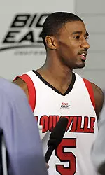 U of L senior guard Taquan Dean speaks with reporters during media day activities.