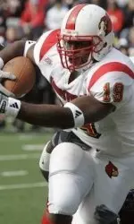 Michael Bush shakes off a tackle by Cincinnati defender Walter Dudley.