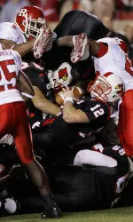 Brian Brohm sneaks into the end zone as Rutgers defenders turn their attention to a diving Louisville running back.