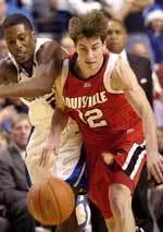 U of L's Brad Gianiny makes a steal against the Wildcats.