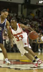 Andre McGee drives around a Fairleigh Dickinson defender in Wednesday's 89-66 win.