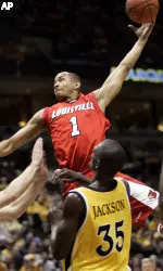 Lorrenzo Wade shoots over the defense of Marquette's Marcus Jackson in the first half of Thursday's road triumph.
