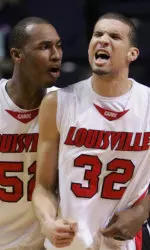 Otis George encourages Francisco Garcia after making a play in the first half.