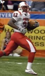 Louisville's Kolby Smith (33) looks back at Syracuse's Tanard Jackson as he scampers into the end zone for a touchdown during the fourth quarter.