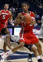 Angel McCoughtry drives past Xavier's Alesia Barringer (AP Photo)