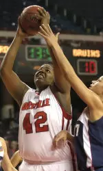 Chauntise Wright gets a shot off over the defense of Belmont's Alysha Clark in the first half. (AP Photo/Timothy D. Easley)