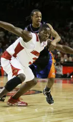 Juan Palacios spreads his arms to keep Savannah State's Jovonni Shuler away from a loose ball.