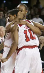 Louisville freshmen Edgar Sosa (10) and Jerry Smith hug after going out to a big lead in the second half of their basketball game against Miami in Louisville, Ky., Saturday, Dec. 23, 2006. Louisville won the game 82-59. (AP Photo/Ed Reinke)