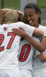 Senior Erica Robinson(on right), celebrates with fellow seniors Monique Gjini(center) and Laura Walker.