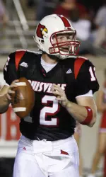 Brian Brohm looks for a receiver during the first half. (AP Photo/Garry Jones)