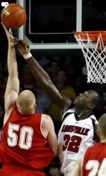 Miami forward Tim Pollitz tries to score inside against Derrick Caracter during first half. (AP Photo/Garry Jones)