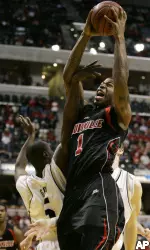 Terrence Williams is fouled by Purdue's Keaton Grant as Williams shoots in the first half. (AP Photo/Michael Conroy)