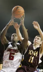 Earl Clark and Iona's Milan Prodanovic vie for a rebound during the first half.