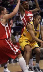 Louisville's Yuliya Tokova, left, and Angel McCoughtry close in on West Virginia's Sparkle Davis as Davis tries to come in for a shot in the first half of the West Virginia-Louisville quarterfinal round game in the Big East Championship basketball game in Hartford, Conn., Sunday, March 4, 2007. (AP Photo/Bob Child)