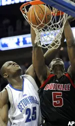 Earl Clark dunks the ball over Seton Hall's Augustine Okosun during first half.