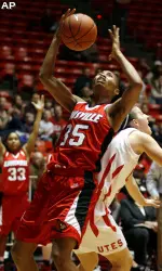 Louisville forward Angel McCoughtry, left, leans on the back of Utah forward Cydney Knight, right, as she tries to gain control of a rebound during the second half. (AP Photo/Steve C. Wilson)