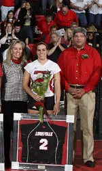 Kristie Wetterer and her parents Jim and Rose during Senior Day introductions.