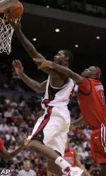 Earl Clark drives past Mississippi defender Terrance Henry. (AP)
