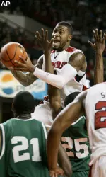 Terrence Williams shoots over UAB defenders Lawrence Kinnard (21) and Channing Toney (25)