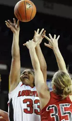 Monique Reid gets a shot off over the defense of Ball State's Danielle Gratton