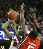 Earl Clark looks over the defense of Rutgers' Hamady Ndiaye as he shoots the ball. (AP Photo/Ed Reinke)