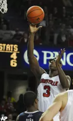 Juan Palacios gets a shot off over the defense of Vilanova's Antonio Pena during the second half. (AP Photo/Timothy D. Easley)
