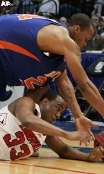 Andre McGee and Boise State's Reggie Larry scramble for a loose ball during the first half. (AP Photo/Rogelio V. Solis)