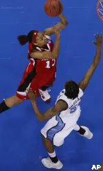 Candyce Bingham shoots over North Carolina forward Jessica Breland in the first half. (AP Photo/Ann Heisenfelt)