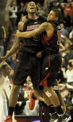 Earl Clark and Edgar Sosa celebrate the 61-60 victory over Villanova at the conclusion Saturday. (AP Photo/Bradley C Bower)