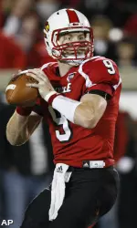 Adam Froman drops back to pass during the second half.