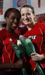 Lecia Brown (left) and Justine Landi pose with their senior bouquets.