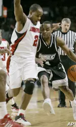Providence's Sharaud Curry tries to drive past Preston Knowles during the first half. (AP Photo/Ed Reinke)