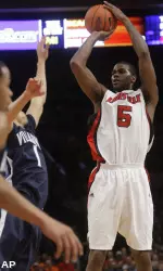 Earl Clark shoots over Villanova's Scottie Reynolds during the first half. (AP)