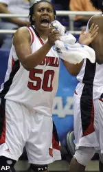 Deseree' Byrd cheers her team on against Liberty in the first half.