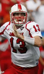 Justin Burke looks for a receiver during the first half.