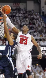 Louisville forward Terrence Jennings blocks a shot attempt by Villanova's Dominic Cheek during the first half of an NCAA college basketball game in Louisville, Ky., Monday, Jan. 11, 2010. (AP Photo/Ed Reinke)